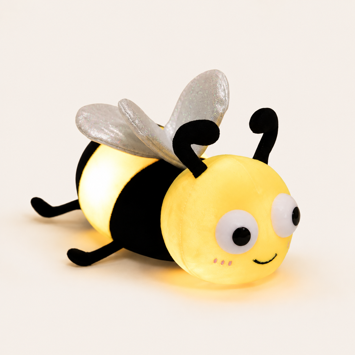 ObiBuzzy – Light-Up Insect Plush Pillow - studio view