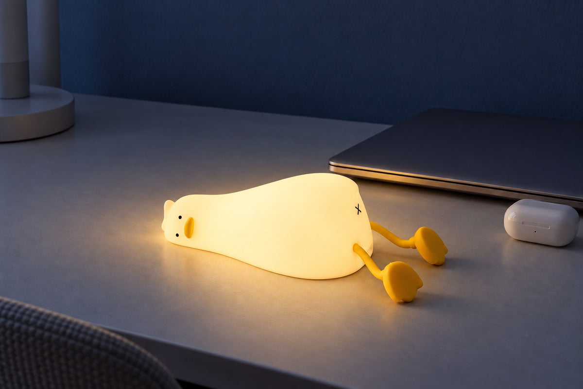ObiFlopsy – Lying-Flat Duck Night Lamp with the light switched on