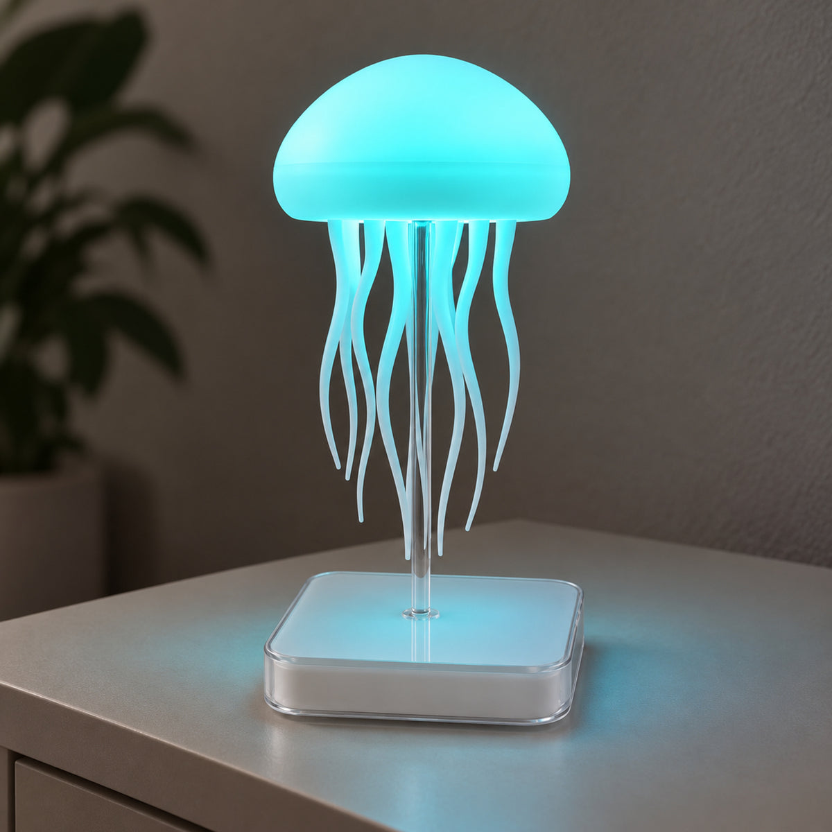 Dancing Jellyfish lamp showing aqua illumination on its clear stem and square base