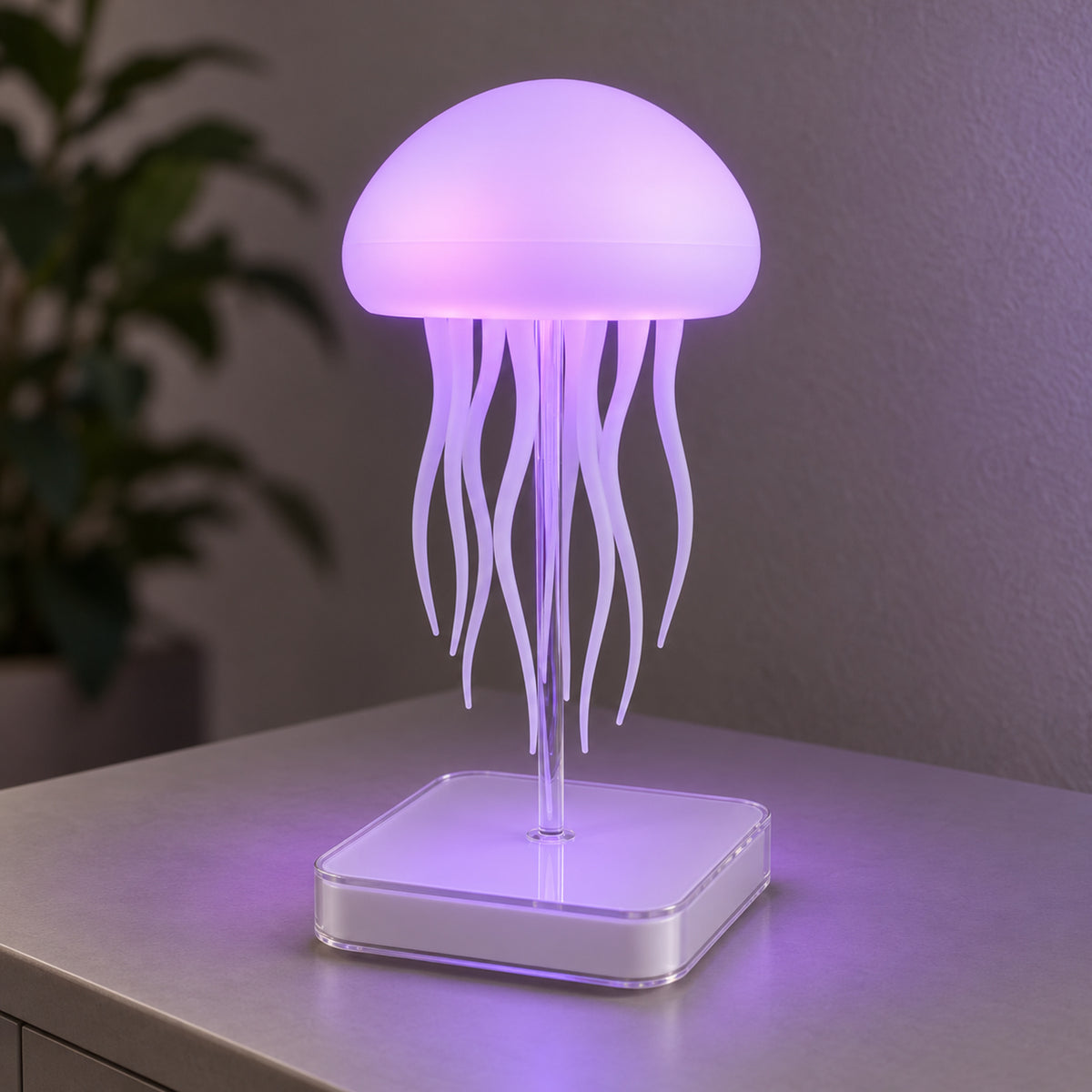 Dancing Jellyfish lamp showing violet illumination on its clear stem and square base