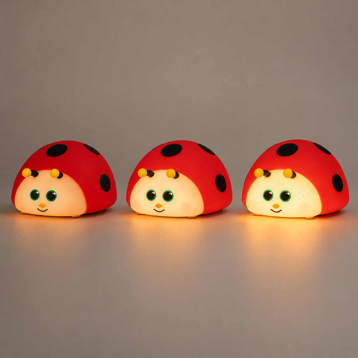 ObiDotty — same ladybug lamp at low, medium and high brightness; qualitative illustration